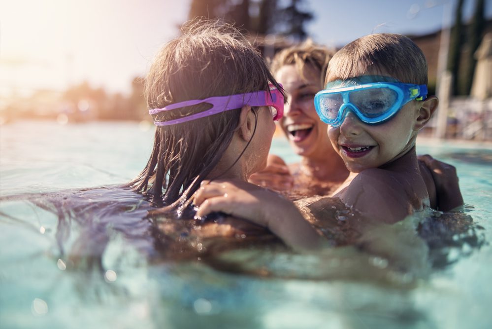 Family playing in swimming pool